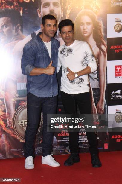 Bollywood actors John Abraham and Manoj Bajpayee during the trailer launch of a movie Satyamev Jayate at PVR ECS, Andheri, on June 28, 2018 in...