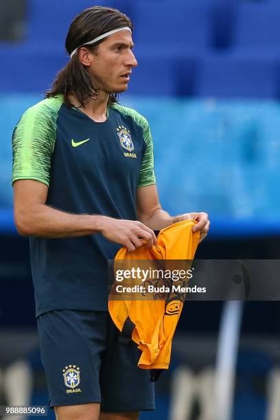 Filipe Luis receives the vest during a Brazil training session ahead of the Round 16 match against Mexico at Samara Arena on July 1, 2018 in Samara,...