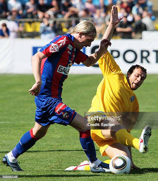 Ivan Zhivanovich of FC Rostov competes for the ball with Tomash Netsid of CSKA Moscow during the Russian Football League Championship match between...