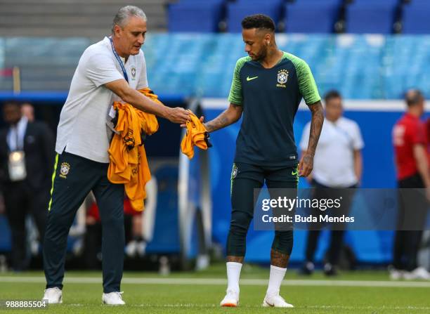 Head coach Tite delivers the vest to Neymar Jr during a Brazil training session ahead of the Round 16 match against Mexico at Samara Arena on July 1,...