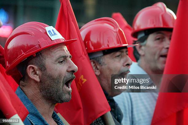 Pro-communist protesters march during an anti-government rally on May 6, 2010 in Athens. Three people, one of them a pregnant woman, were killed when...