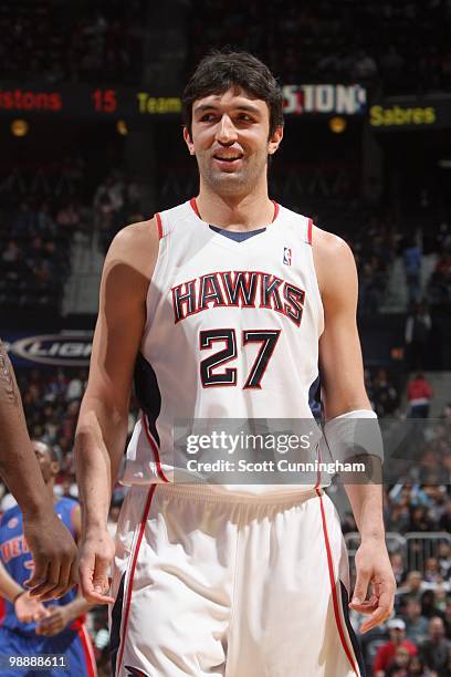 Zaza Pachulia of the Atlanta Hawks smiles on court against the Detroit Pistons during the game on March 13, 2010 at Philips Arena in Atlanta,...