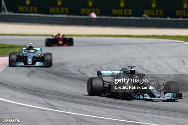 Lewis Hamilton of Great Britain driving the Mercedes AMG Petronas F1 Team Mercedes WO9 leads Valtteri Bottas driving the Mercedes AMG Petronas F1...