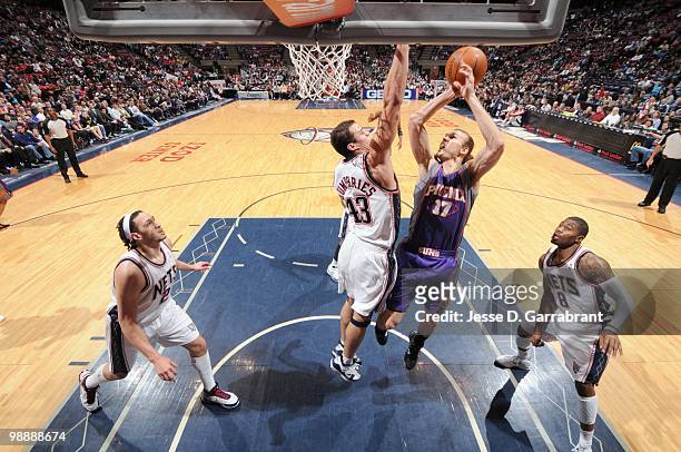 Louis Amundson of the Phoenix Suns puts a shot up against Kris Humphries of the New Jersey Nets during the game on March 31, 2010 at the Izod Center...