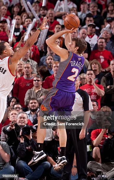 Goran Dragic of the Phoenix Suns shoots against Jerryd Bayless of the Portland Trail Blazers in Game Six of the Western Conference Quarterfinals...