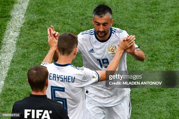 Russia's midfielder Alexander Samedov is replaced by Russia's midfielder Denis Cheryshev during the Russia 2018 World Cup round of 16 football match...