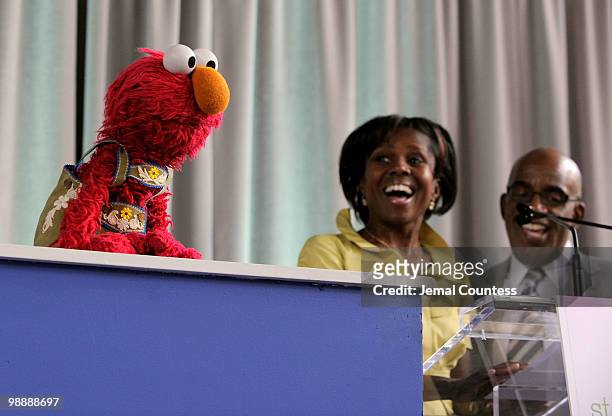 Sesame Street resident Elmo joins media personalities Deborah Roberts and Al Roker as they address the crowd at the screening of "Families Stand...