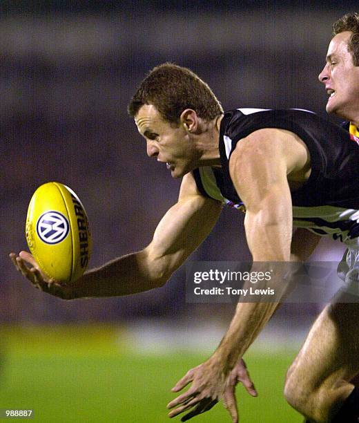 James Clement of Collingwood marks in the match between the Adelaide Crows and the Collingwood Magpies in round 13 of the AFL played at Football Park...