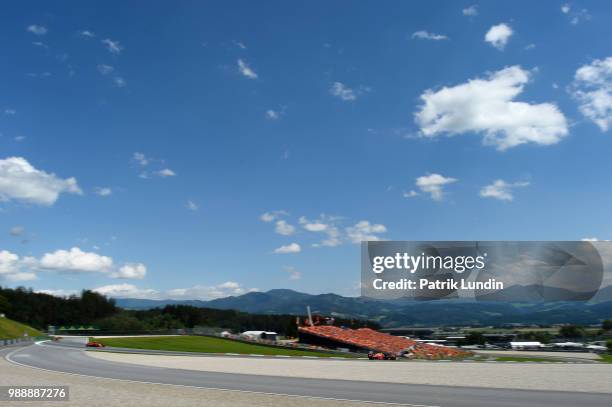 Max Verstappen of the Netherlands driving the Aston Martin Red Bull Racing RB14 TAG Heuer leads Kimi Raikkonen of Finland driving the Scuderia...