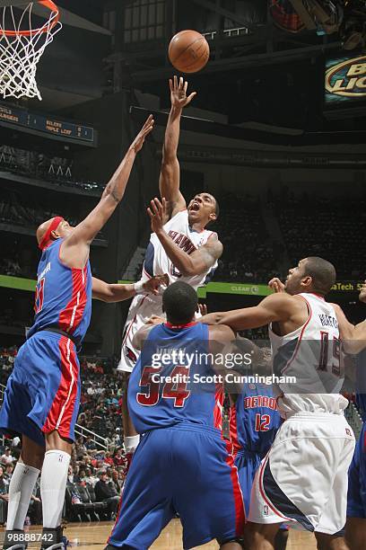 Jeff Teague of the Atlanta Hawks puts a shot up against the Detroit Pistons during the game on March 13, 2010 at Philips Arena in Atlanta, Georgia....