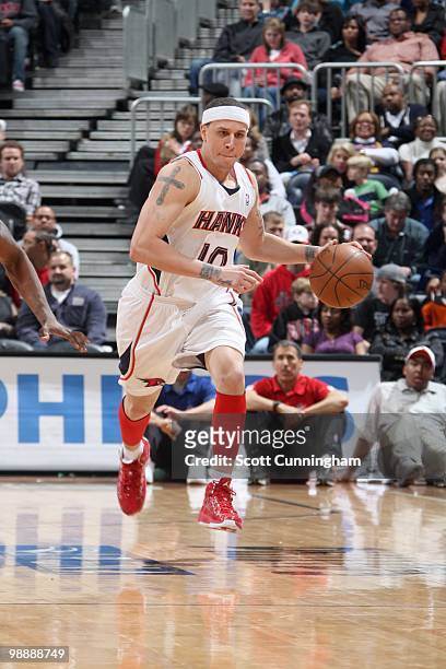 Mike Bibby of the Atlanta Hawks drives the ball against the Detroit Pistons during the game on March 13, 2010 at Philips Arena in Atlanta, Georgia....