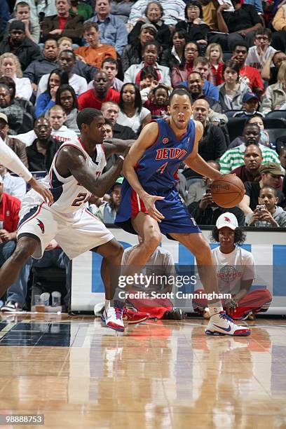 Tayshaun Prince of the Detroit Pistons moves the ball against Marvin Williams of the Atlanta Hawks during the game on March 13, 2010 at Philips Arena...