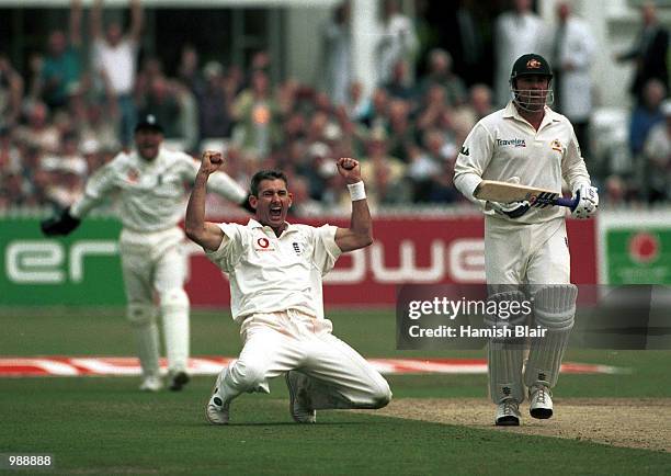 Andrew Caddick of England celebrates the wicket of Shane Warne of Australia during the first day of the Npower Third Test match between England and...