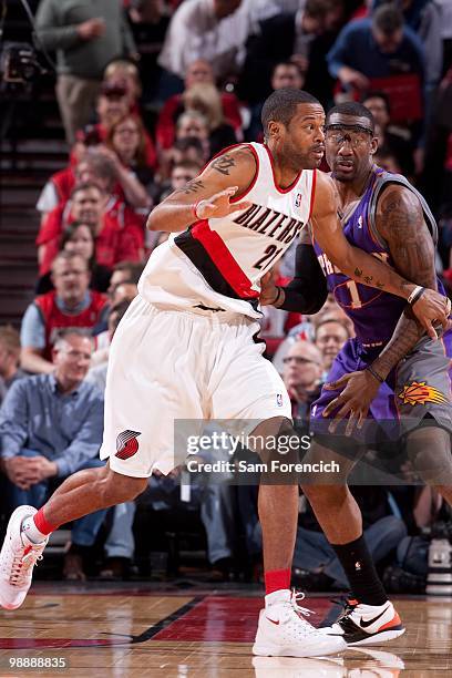 Marcus Camby; #21 of the Portland Trail Blazers is defended by Amare Stoudemire of the Phoenix Suns in Game Six of the Western Conference...