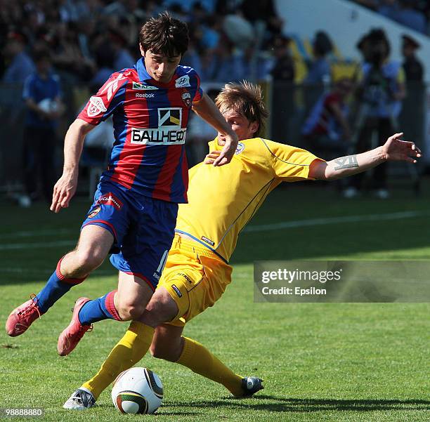 Stanislav Ivanov of FC Rostov Rostov-on-Don battles for the ball with Alan Dzagoev of PFC CSKA Moscow in action during the Russian Football League...