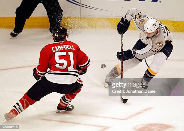 Colin Wilson of the Nashville Predators and Brian Campbell of the Chicago Blackhawks move to the puck in Game Five of the Western Conference...