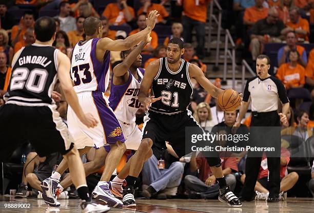 Tim Duncan of the San Antonio Spurs handles the ball against the Phoenix Suns during Game One of the Western Conference Semifinals of the 2010 NBA...