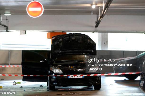 This picture taken on July 1, 2018 in Aulnay-sous-Bois, north of Paris shows a car abandoned by French robber Redoine Faid at O'Parinor shopping mall...