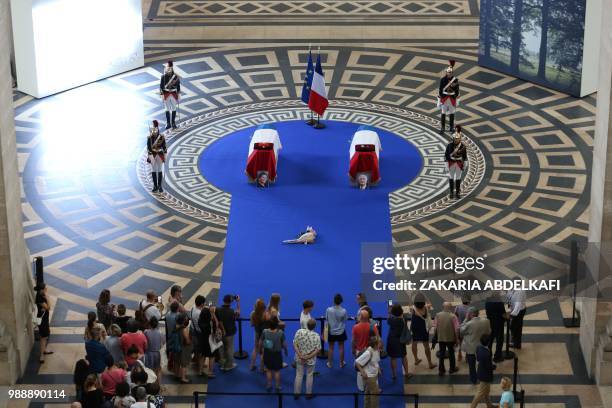Republican Guards stand around the coffins of former French politician and Holocaust survivor Simone Veil and her husband Antoine Veil as visitor pay...