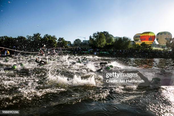 Athletes compete during the swim leg at the DATEV Challenge Roth 2018 on July 1, 2018 in Roth, Germany.