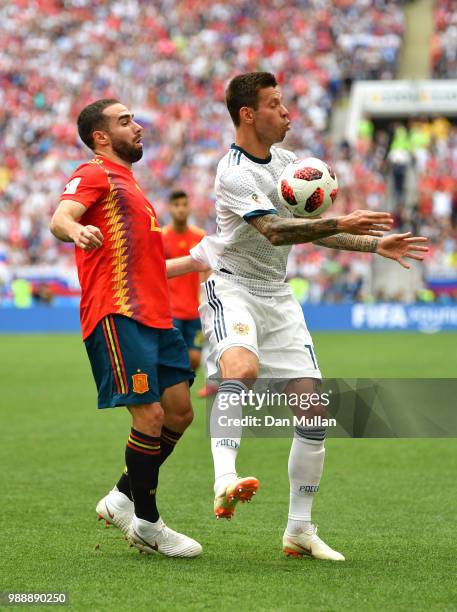 Fedor Smolov of Russia controls the ball under pressure from Dani Carvajal of Spain during the 2018 FIFA World Cup Russia Round of 16 match between...