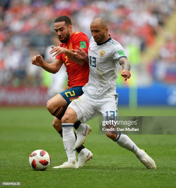 Fedor Kudriashov of Russia is challenged by Dani Carvajal of Spain during the 2018 FIFA World Cup Russia Round of 16 match between Spain and Russia...