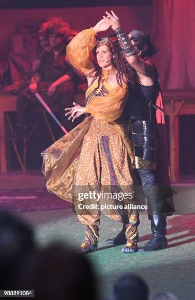 June 2018, Germany, Zinnowitz: Paola Brandenburg as Gunara and Reiko Roelz as Jaron performing on stage. The 22nd Vineta Festival opened to around...