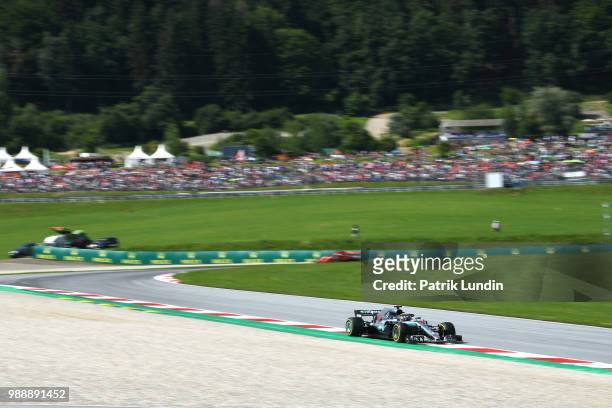 Lewis Hamilton of Great Britain driving the Mercedes AMG Petronas F1 Team Mercedes WO9 on track during the Formula One Grand Prix of Austria at Red...