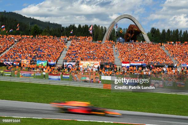 Max Verstappen of the Netherlands driving the Aston Martin Red Bull Racing RB14 TAG Heuer passes a grandstand filled with his fans during the Formula...