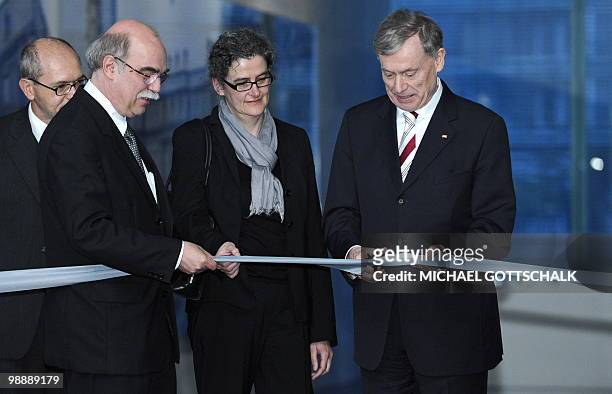 German President Horst Koehler cuts the ribbon during the inauguration ceremony of the new "Topographie des Terrors" museum next to achitect Ursula...