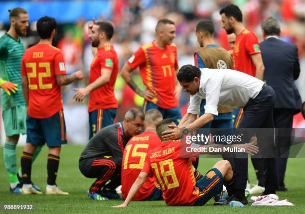 Fernando Hierro, Head coach of Spain speaks with Sergio Ramos of Spain and Jordi Alba of Spain before extra time is played during the 2018 FIFA World...