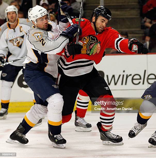 Andrew Ladd of the Chicago Blackhawks battles with Dan Hamhuis of the Nashville Predators in Game Five of the Western Conference Quarterfinals during...