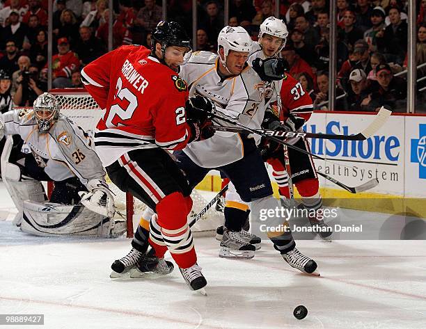 Troy Brouwer of the Chicago Blackhawks battles with Ryan Suter of the Nashville Predators in Game Five of the Western Conference Quarterfinals during...