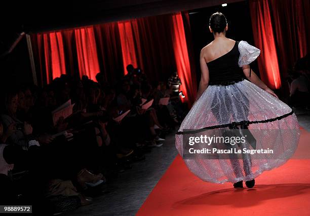 Model of the association "Tissons la Solidarite" walks down the runway at Docks en Seine on May 6, 2010 in Paris, France. Christian Lacroix sponsored...