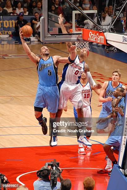 Carlos Boozer of the Utah Jazz goes up for a jump shot against Drew Gooden of the Los Angeles Clippers during the game on March 1, 2010 at Staples...