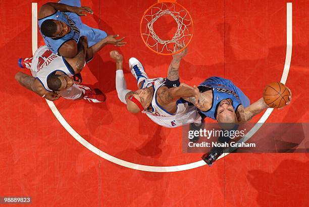 Carlos Boozer of the Utah Jazz goes up for a jump shot against Drew Gooden of the Los Angeles Clippers during the game on March 1, 2010 at Staples...