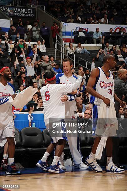 Steve Novak and Bobby Brown of the Los Angeles Clippers celebrate from the bench area during their NBA game against the Utah Jazz on March 1, 2010 at...