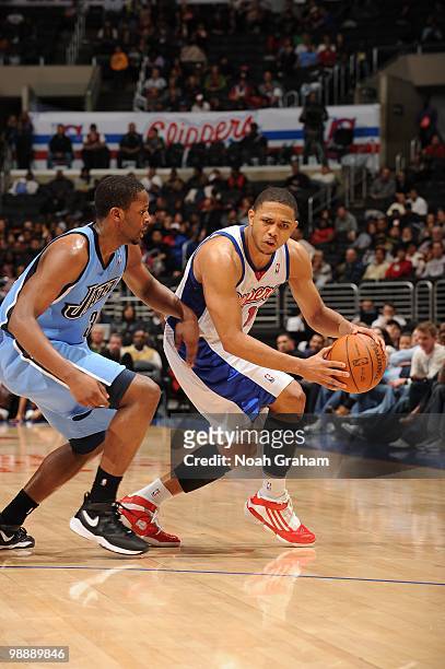 Eric Gordon of the Los Angeles Clippers dribble drives against Wesley Matthews of the Utah Jazz during the game on March 1, 2010 at Staples Center in...