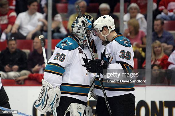 Logan Couture congratulates Evgeni Nabokov of the San Jose Sharks following the game against the Detroit Red Wings in Game Three of the Western...