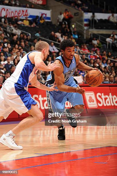 Ronny Price of the Utah Jazz dribble drives to the basket against Steve Blake of the Los Angeles Clippers during the game on March 1, 2010 at Staples...