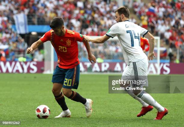 Marco Asensio of Spain is challenged by Vladimir Granat of Russia during the 2018 FIFA World Cup Russia Round of 16 match between Spain and Russia at...