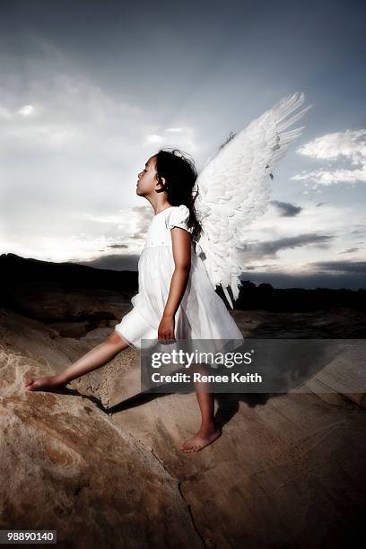 little girl angel in the desert - angel white dress stock-fotos und bilder