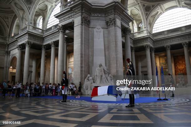 People pay their respects by the coffins of former French politician and Holocaust survivor Simone Veil and her husband Antoine Veil surrounded by...