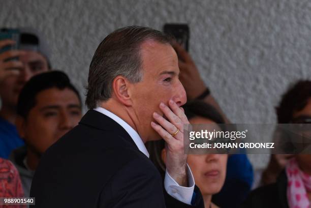Mexico's presidential candidate Jose Antonio Meade for "Todos por Mexico" coalition party, gestures after casting his vote during general elections,...