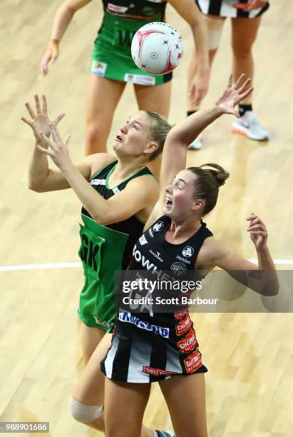 Alice Teague-Neeld of the Magpies and Courtney Bruce of the Fever compete for the ball during the round nine Super Netball match between the Magpies...
