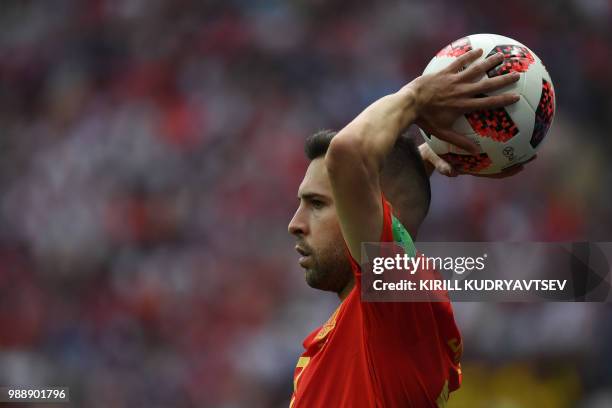 Spain's defender Jordi Alba prepares to throw-in during the Russia 2018 World Cup round of 16 football match between Spain and Russia at the Luzhniki...