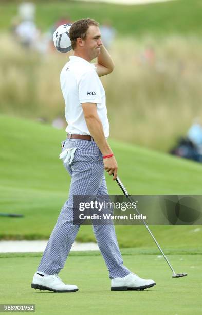 Justin Thomas of The USA reacts on the 18th hole during day four of the HNA Open de France at Le Golf National on July 1, 2018 in Paris, France.