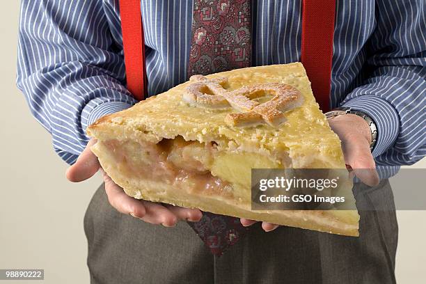 banker holds dollar slice of the pie - newpremiumuk stock pictures, royalty-free photos & images