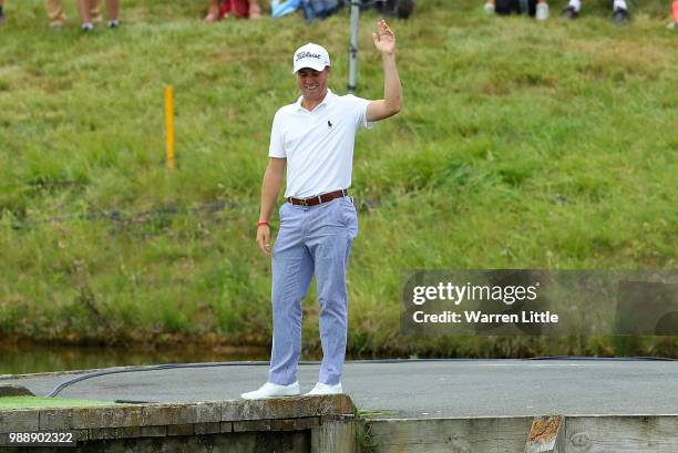 Justin Thomas of The USA reacts after nearly chipping in from the bridge on the 18th hole during day four of the HNA Open de France at Le Golf...