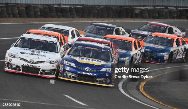 Derek Kraus leads the pack around the turn on his way to winning the Clint Newell Toyota 150 presnted by NAPA Auto Parts for the NASCAR K&N West...